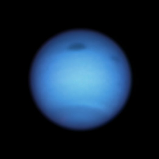 The Dark Spots on Neptune